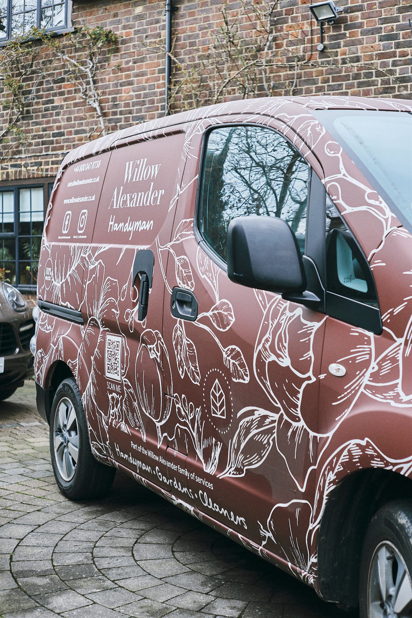 A Willow Alexander Handyman van parked outside a property