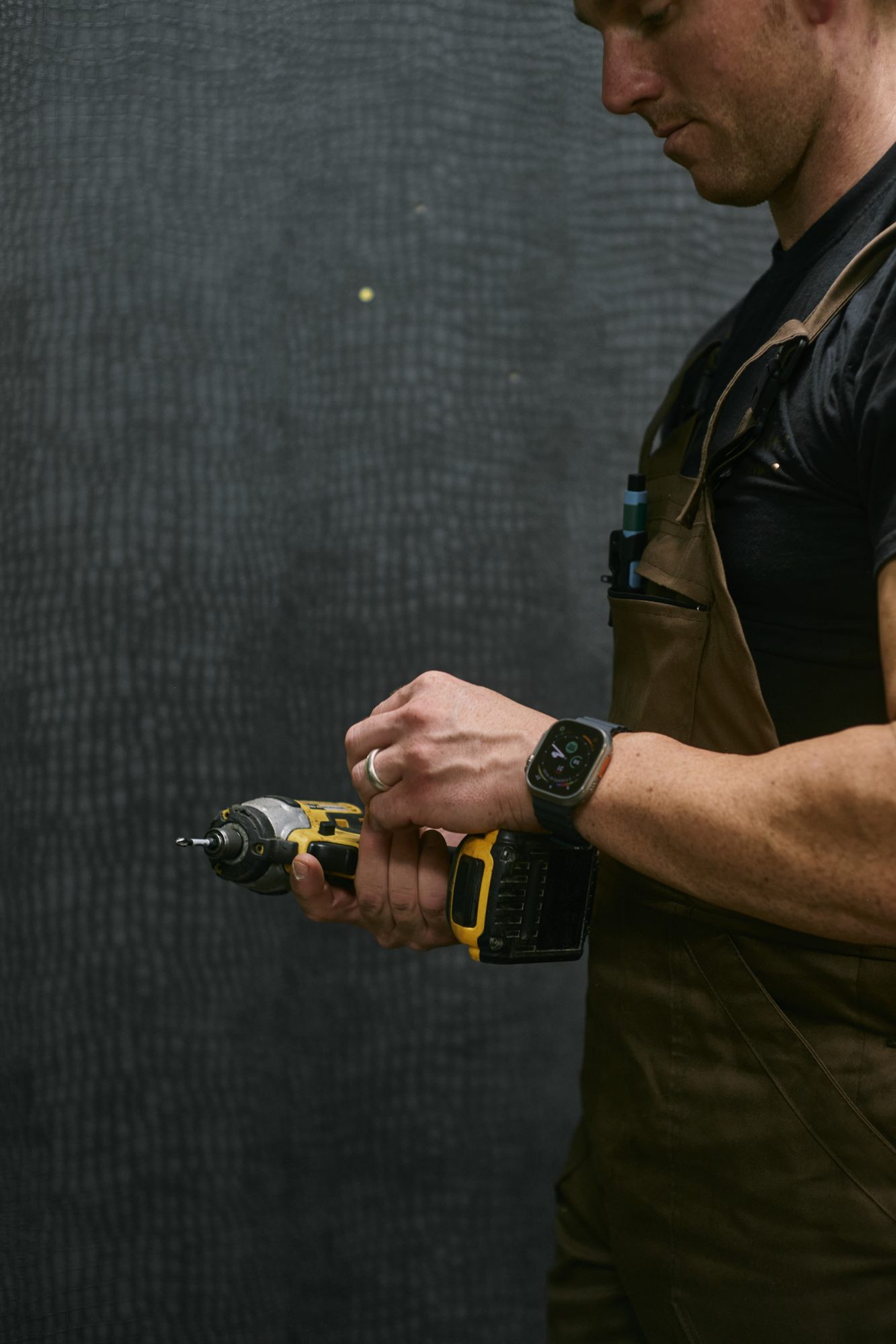 A Willow Alexander handyman assembling furniture in a London home