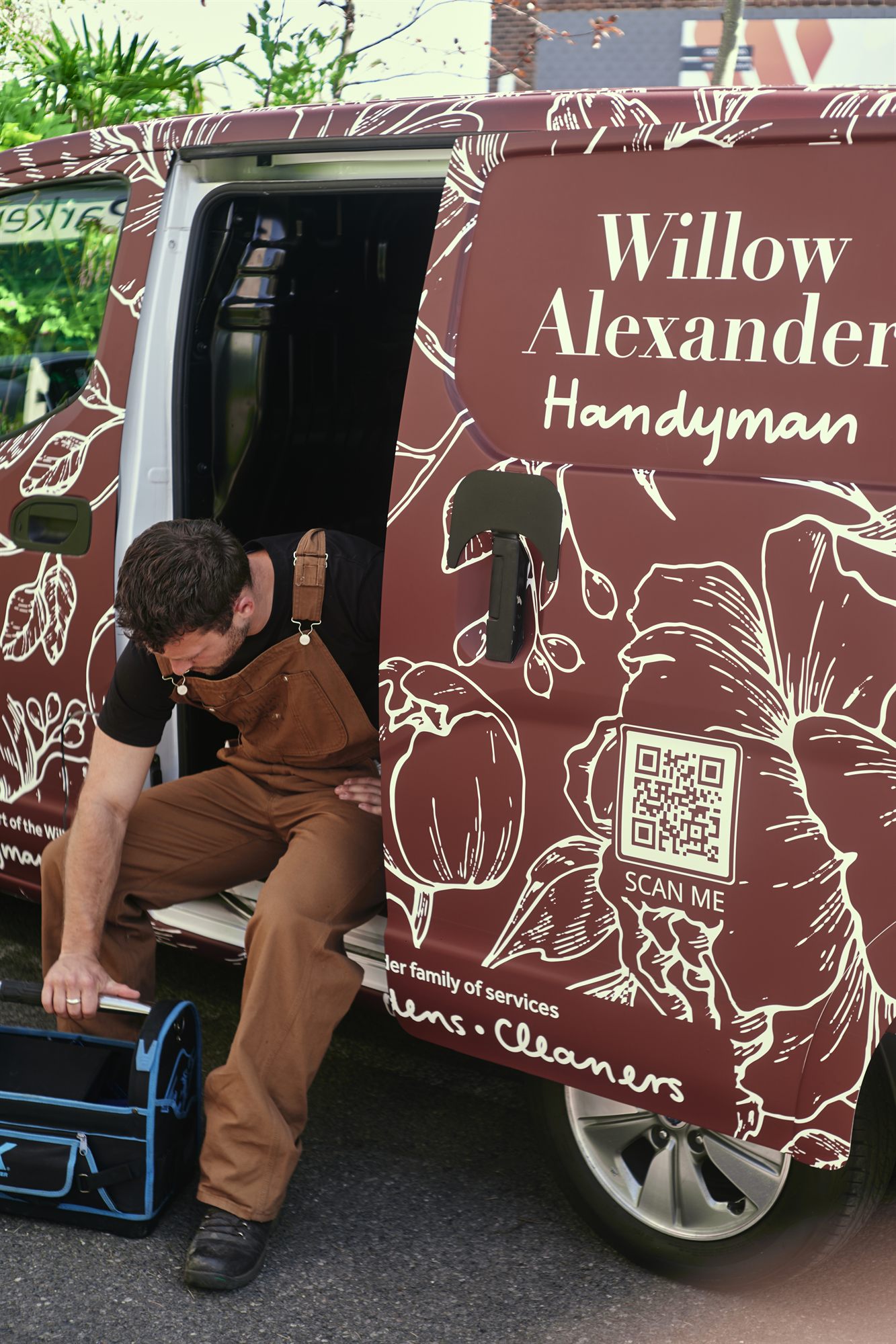 A Willow Alexander handyman unloading tools from the van